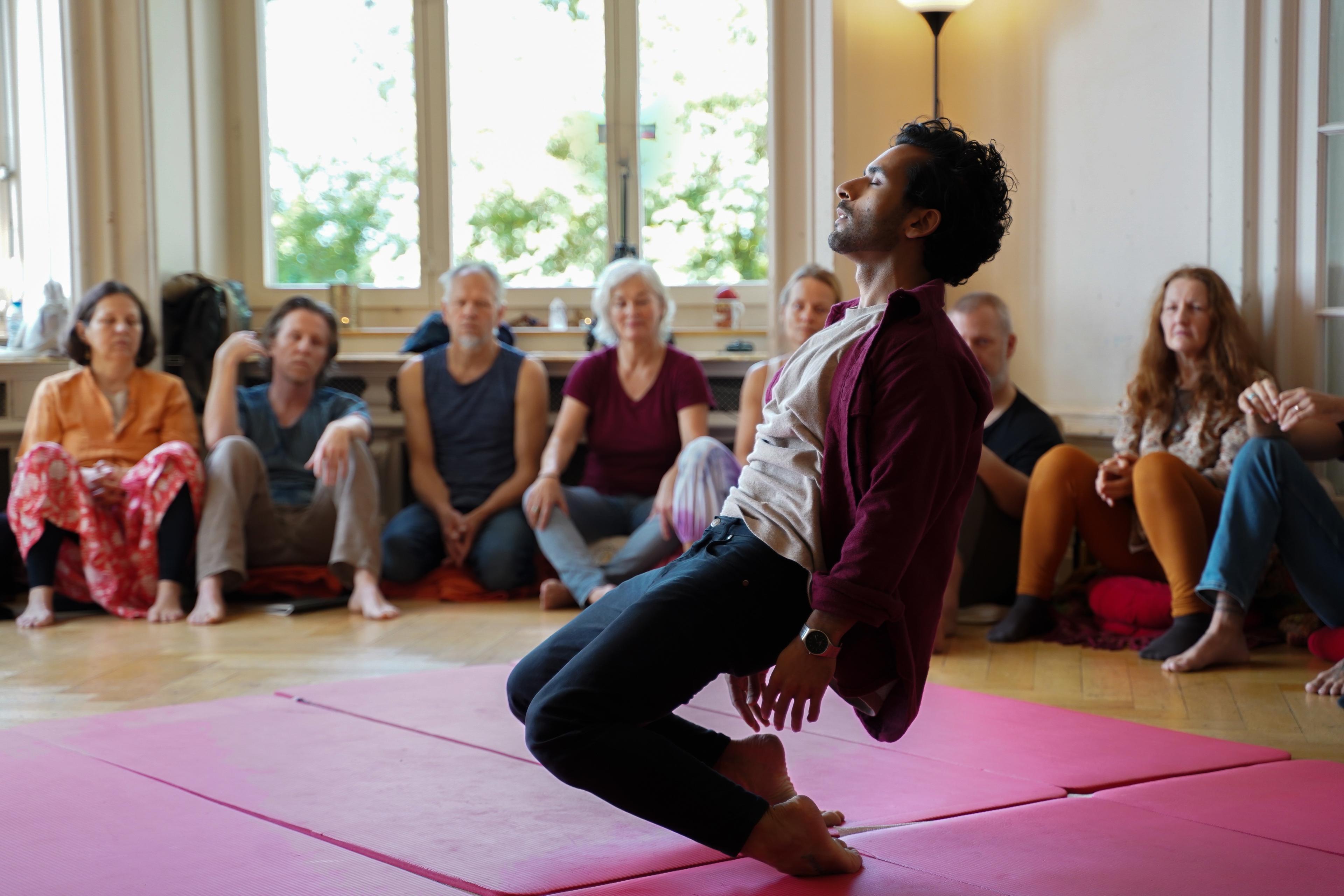 A participant expressing through his body while a Heart iQ circle witnesses him