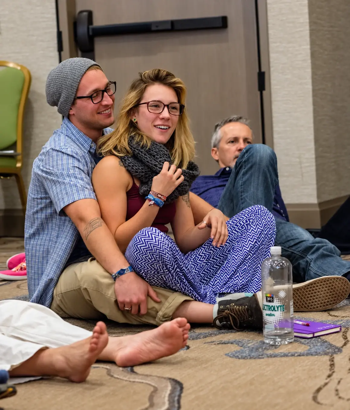 A couple sitting together during a group session