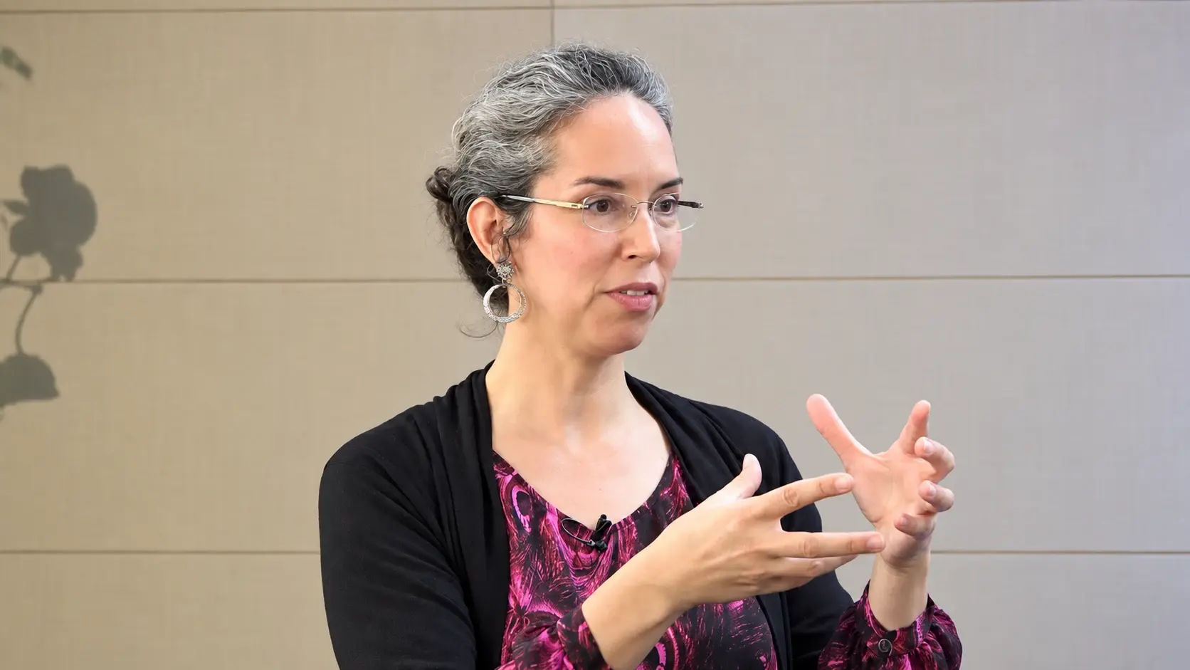 Stephanie explaining a practice through a hand gesture