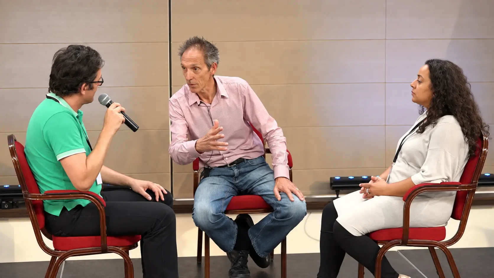 A facilitator guiding a couple in conversation