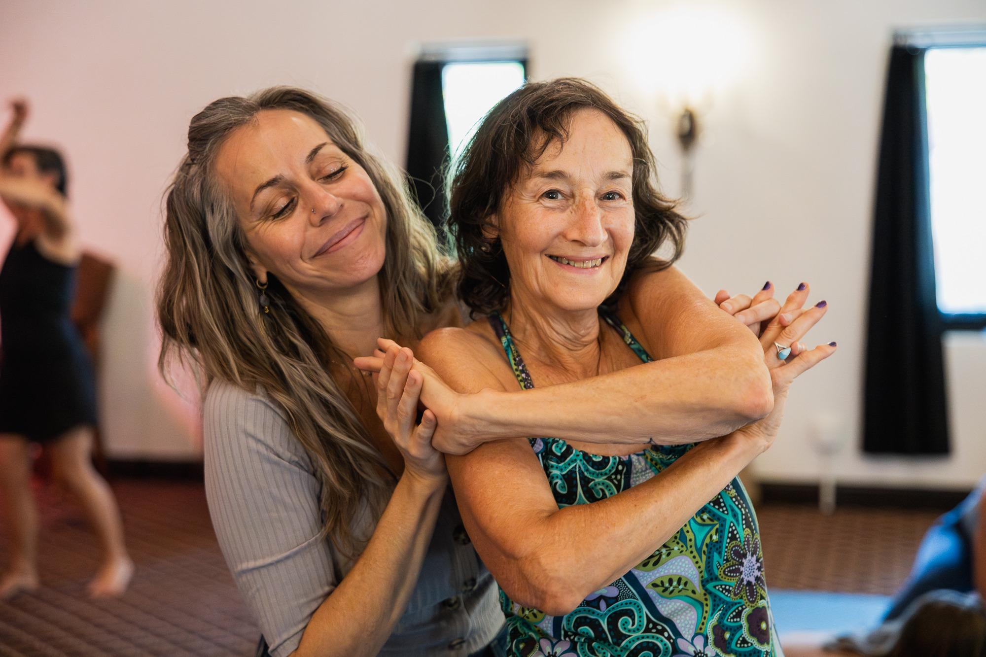 Two Heart iQ participants sharing a warm embrace