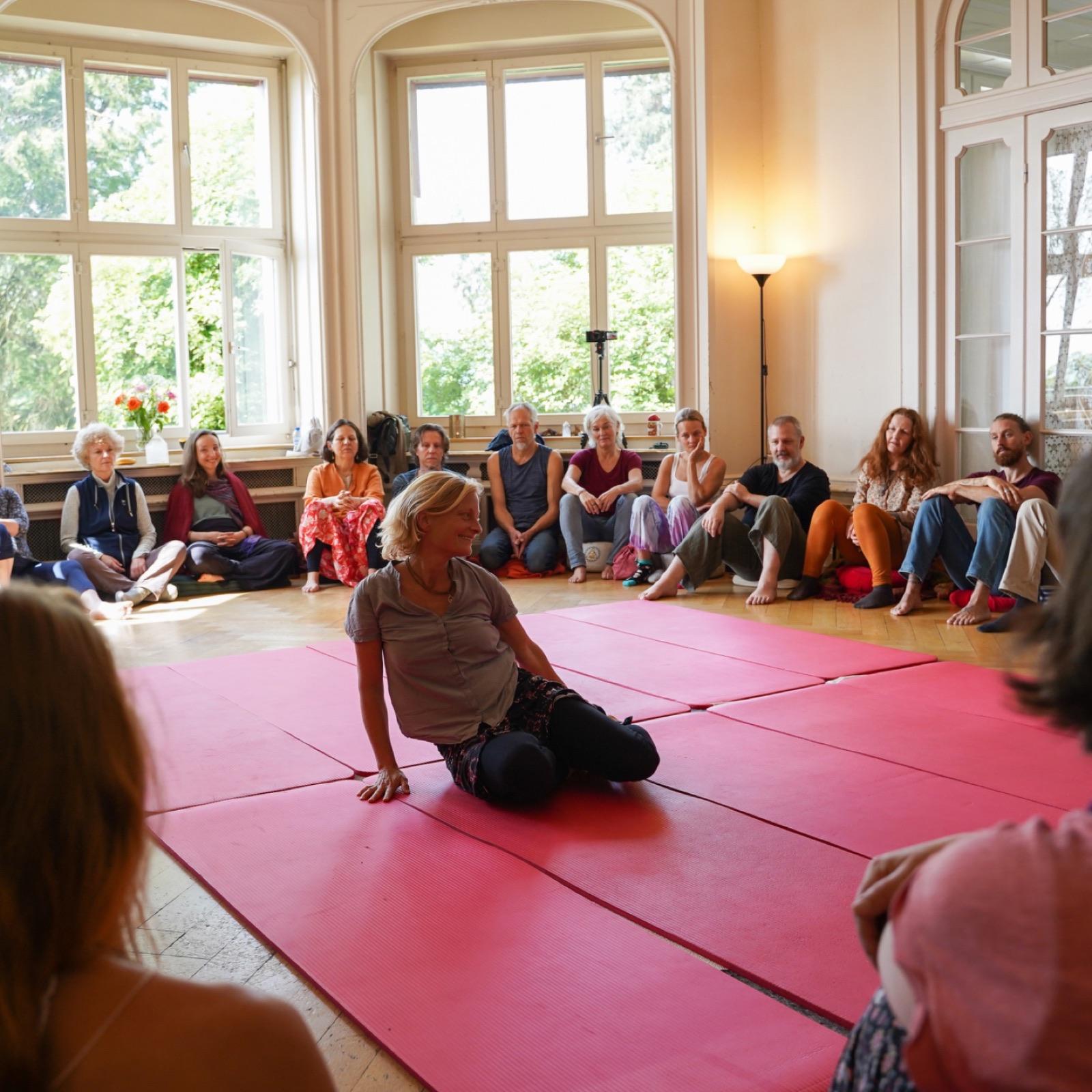 A Heart iQ circle in session, one person held in the centre