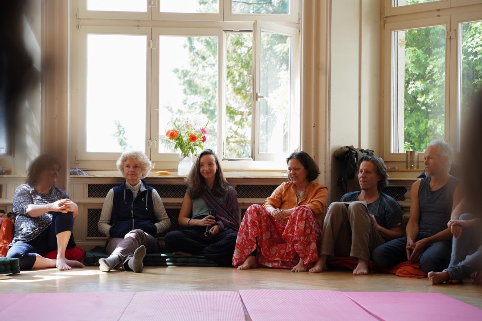 People sitting together in a Heart iQ circle
