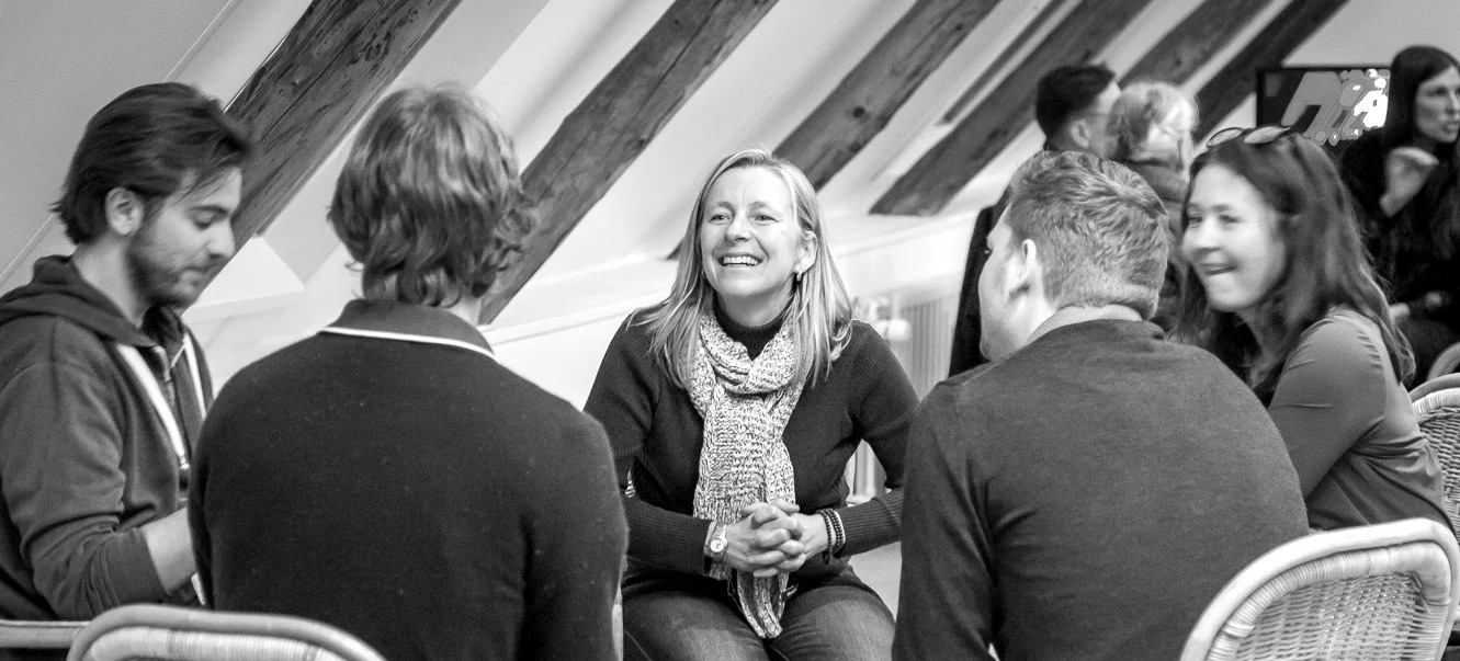 A small circle in conversation at the Somatic Shadow and Circle Work training